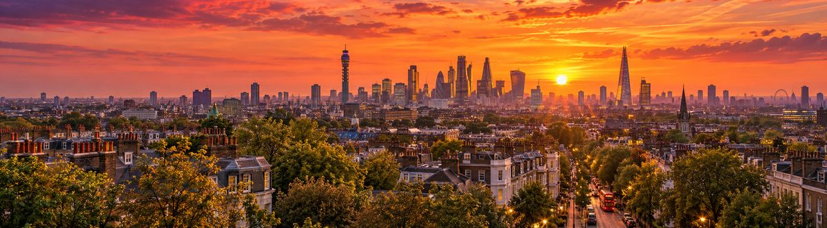 London rooftops and the City skyline at sunset